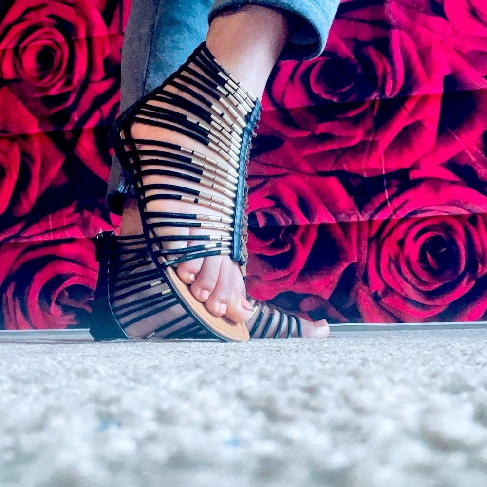 Black and gold sandals. Zipper in the back. Size 8